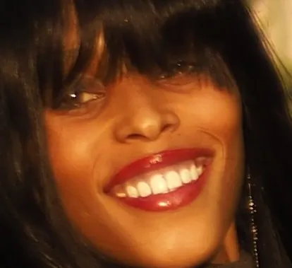 Pixel-level crop of her eyes, fringe and smile