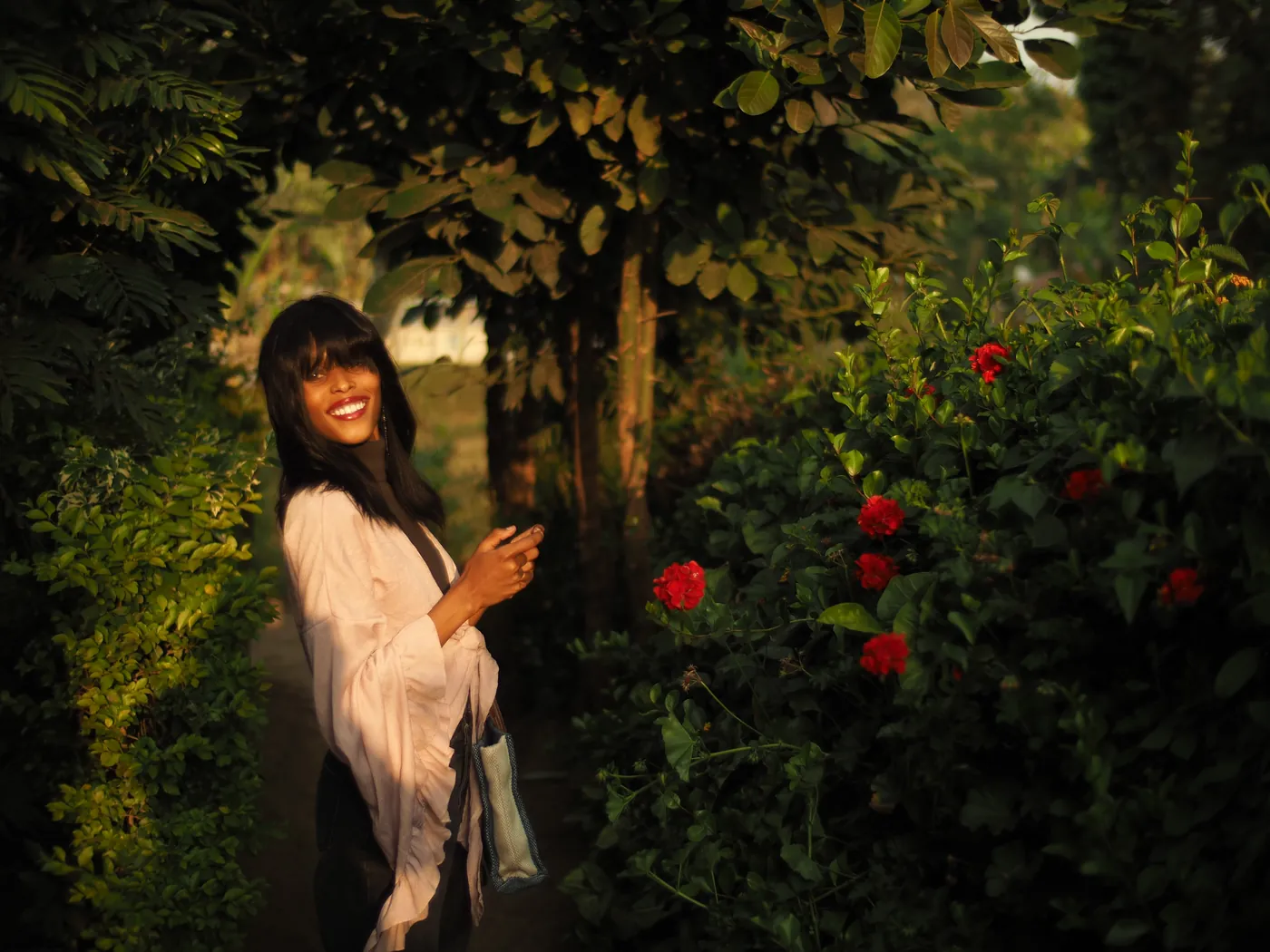 The full photo again, the woman looking back on the shaded garden path