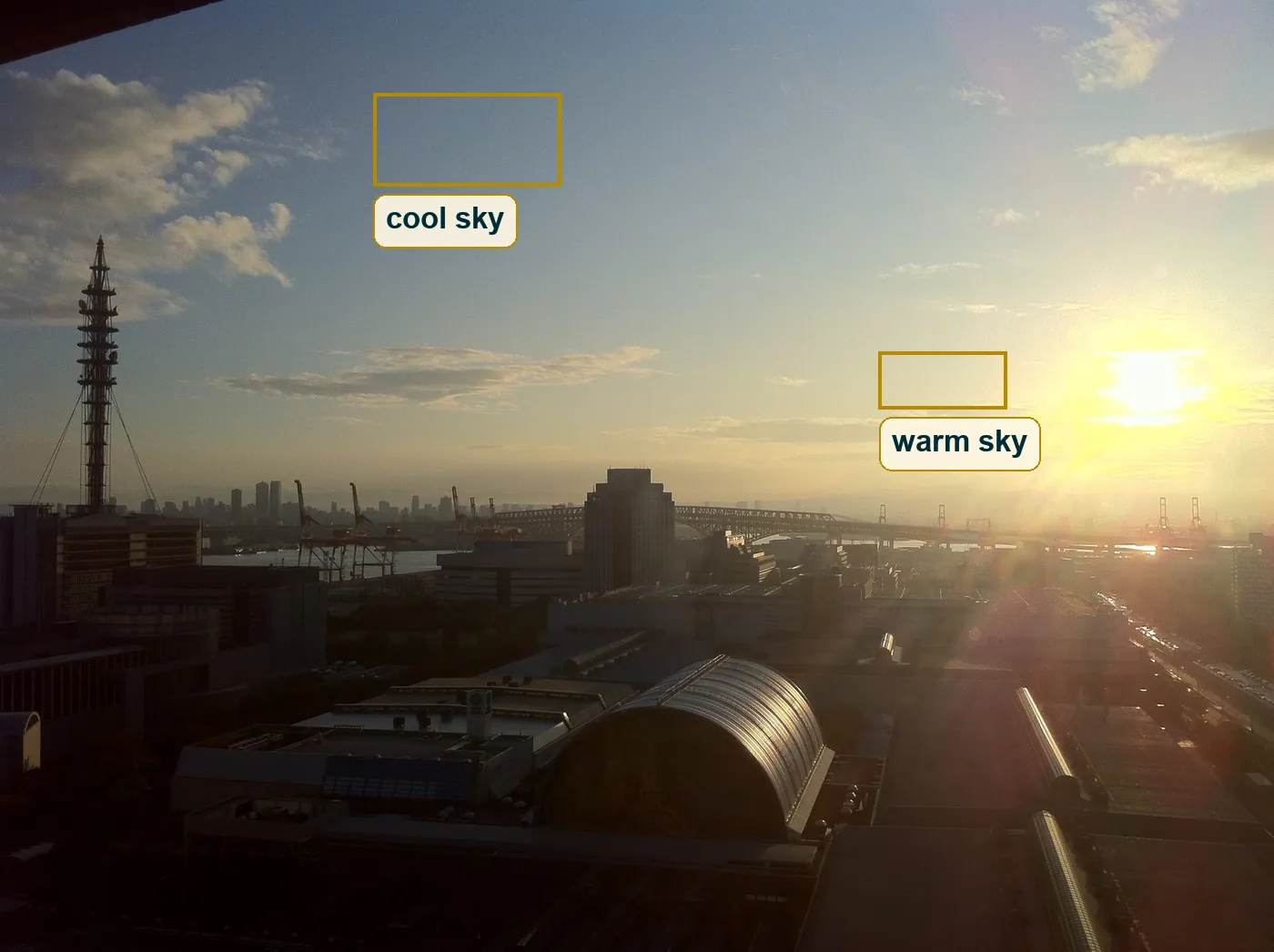 Full frame with a sample of cool blue sky on the left and warm cream sky on the right boxed