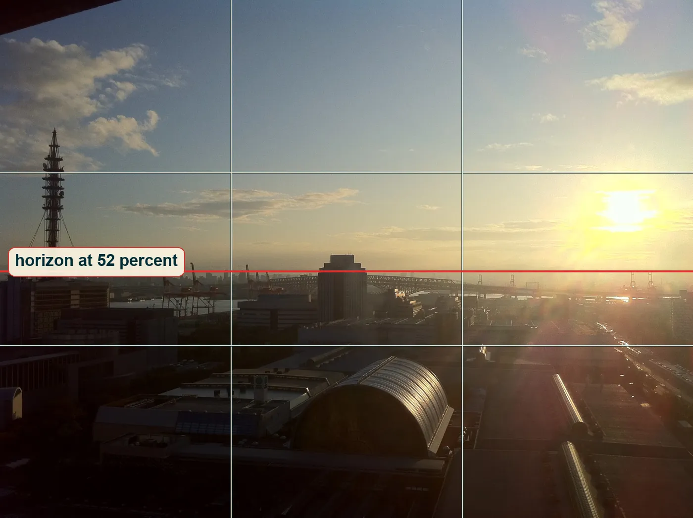Full frame with a thirds grid and the horizon line drawn just below the middle
