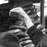 Crop at full resolution of the raised fist against the simit rings