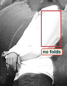 Crop of the leaning boy white shirt with a red box on the area that has gone pure white
